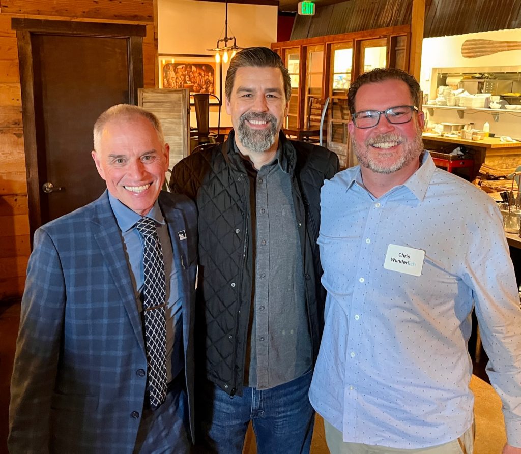 3 People Posing for A photo